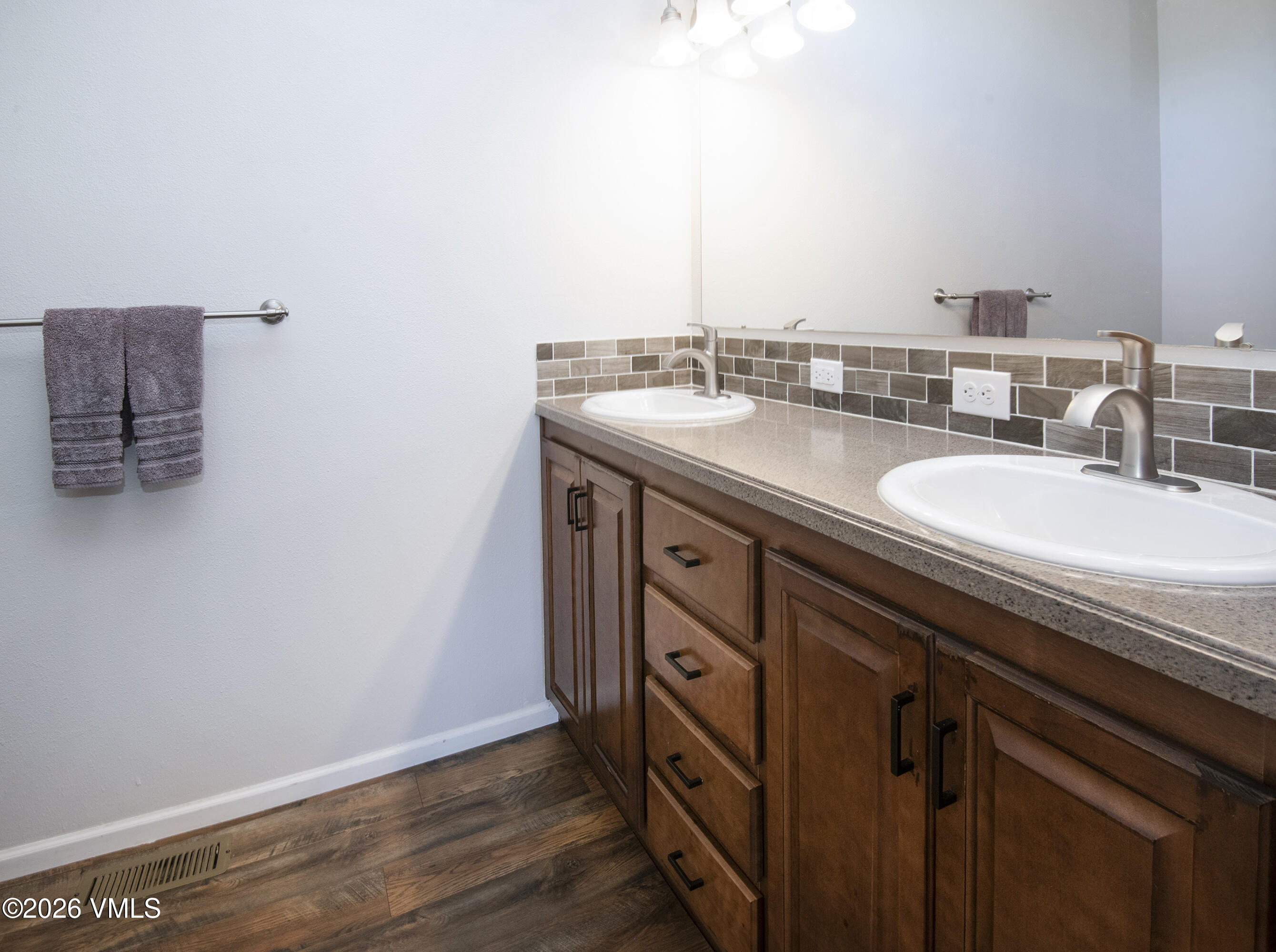67 Maverick Court Gypsum, CO 81637 - Photo 16 of 40 a bathroom with a sink and a mirror