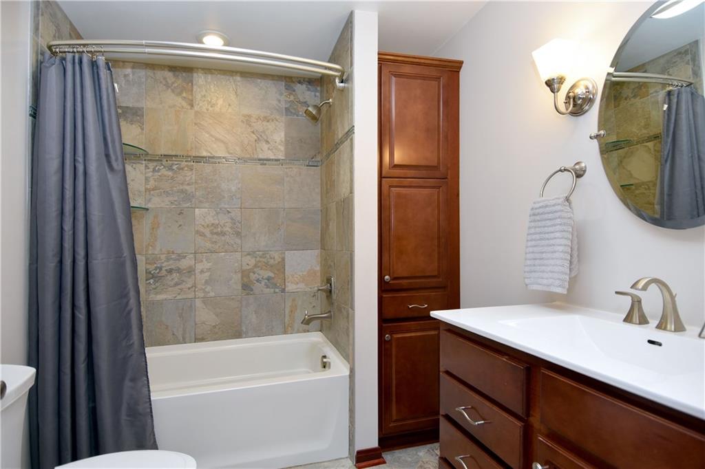 560 Tevebaugh Hollow Road Freedom, PA 15042 - Photo 13 of 23 The updated full bath features a ceramic surround tub/shower and built-in linen closet.