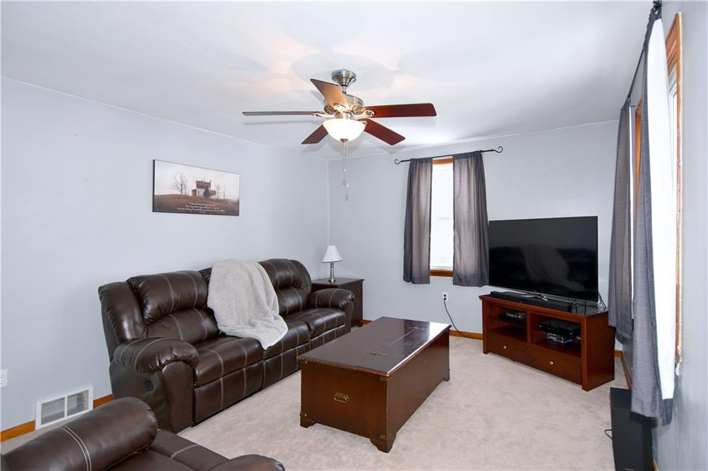 560 Tevebaugh Hollow Road Freedom, PA 15042 - Photo 4 of 23 To the right, the large living room detailed with a ceiling fan.
