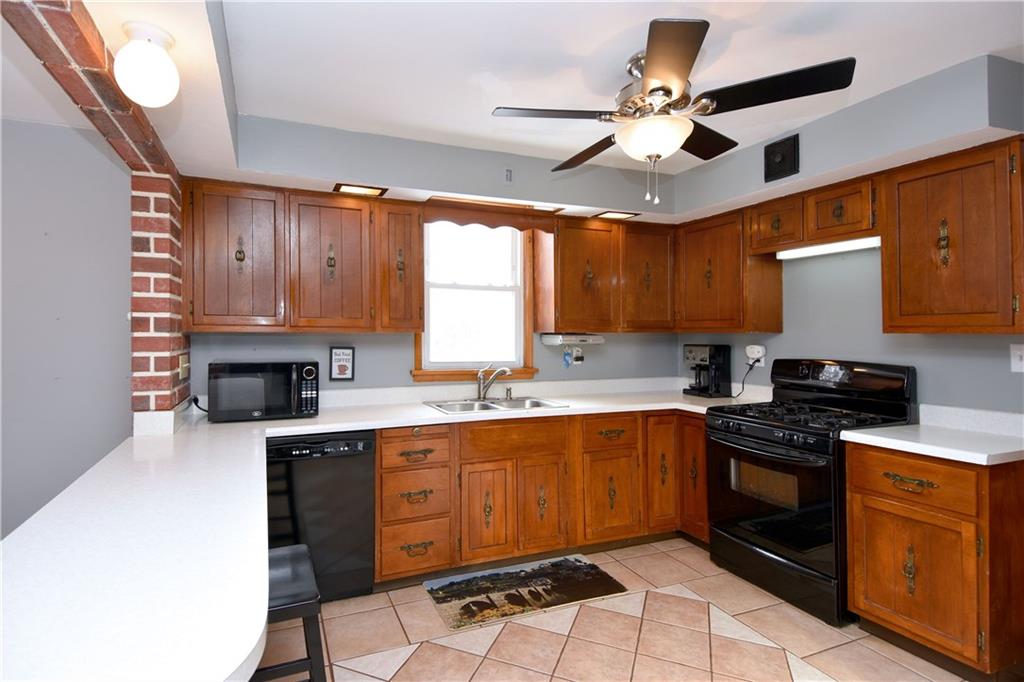 560 Tevebaugh Hollow Road Freedom, PA 15042 - Photo 9 of 23 The large kitchen is highlighted with a custom designed ceramic floor which completes the room.