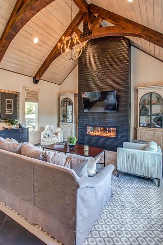 6664 Cross Keys Road College Grove, TN 37046 - Photo 12 of 29 Family room w/vaulted ceiling, wood/iron sphere chandelier & gas fireplace w/wood surround.