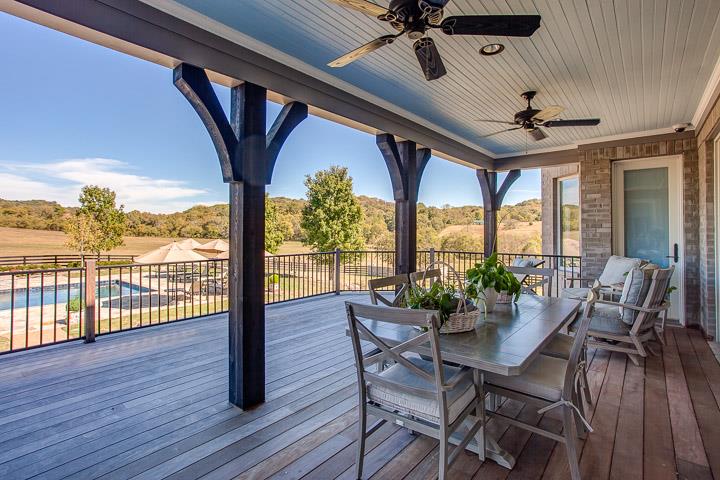 6664 Cross Keys Road College Grove, TN 37046 - Photo 10 of 29 Just off the living room & kitchen/eating area. Mostly covered with railing overlooking a beautiful view of the pool & rolling hills!