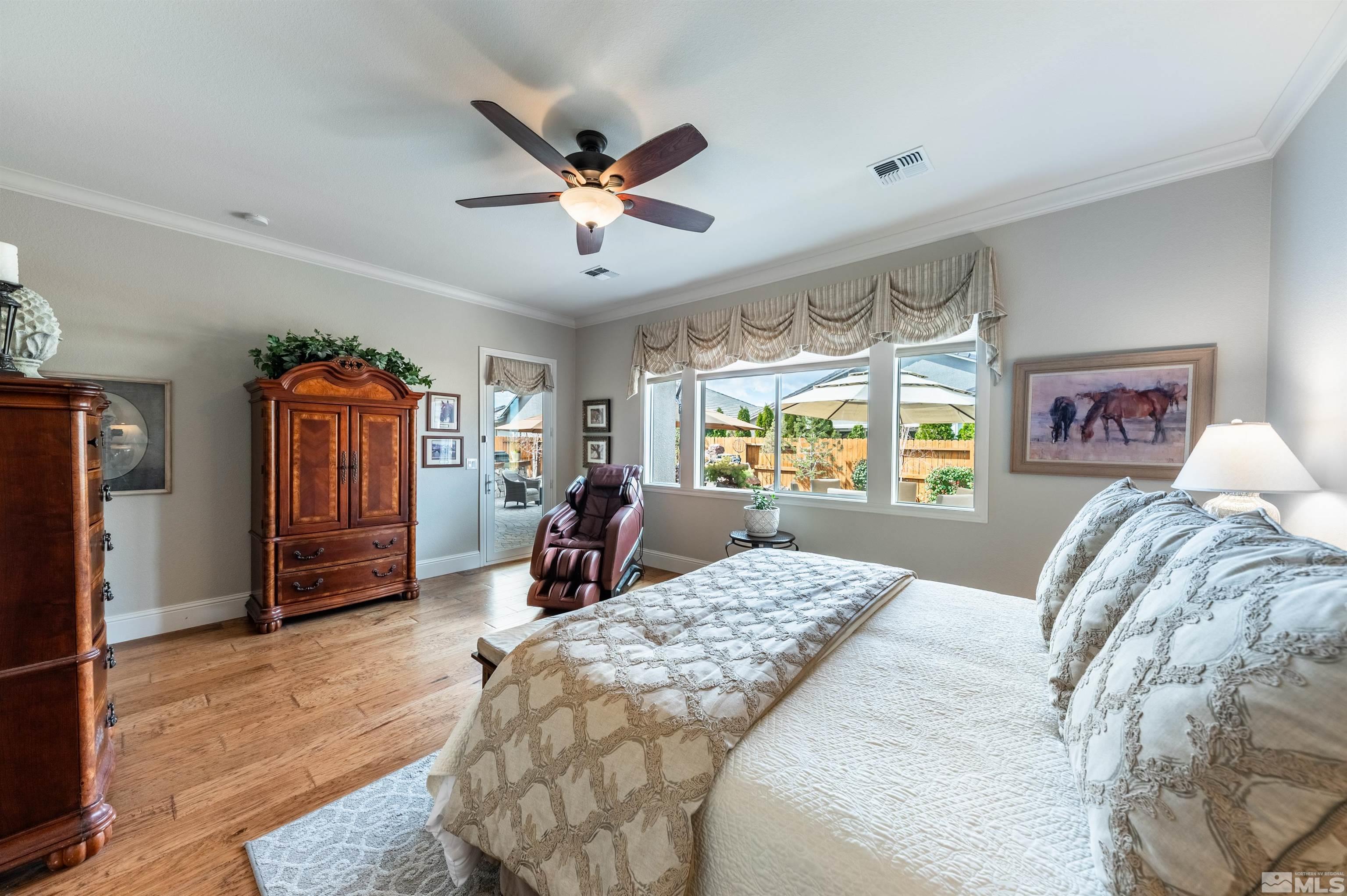 9805 Shadowless Trail Reno, NV 89521 - Photo 12 of 33 a bed room with a bed and a window