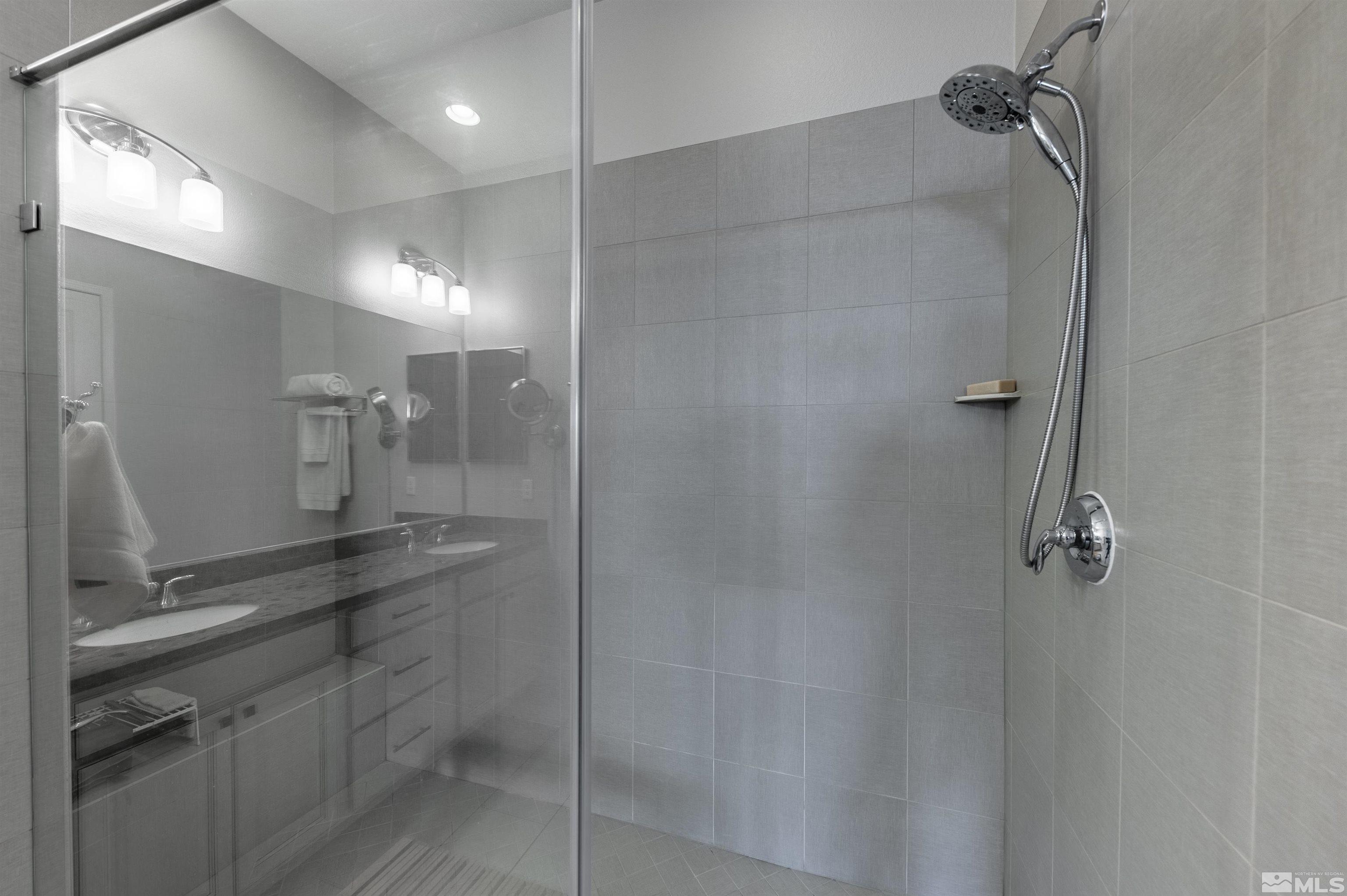 9805 Shadowless Trail Reno, NV 89521 - Photo 14 of 33 a bathroom with a shower