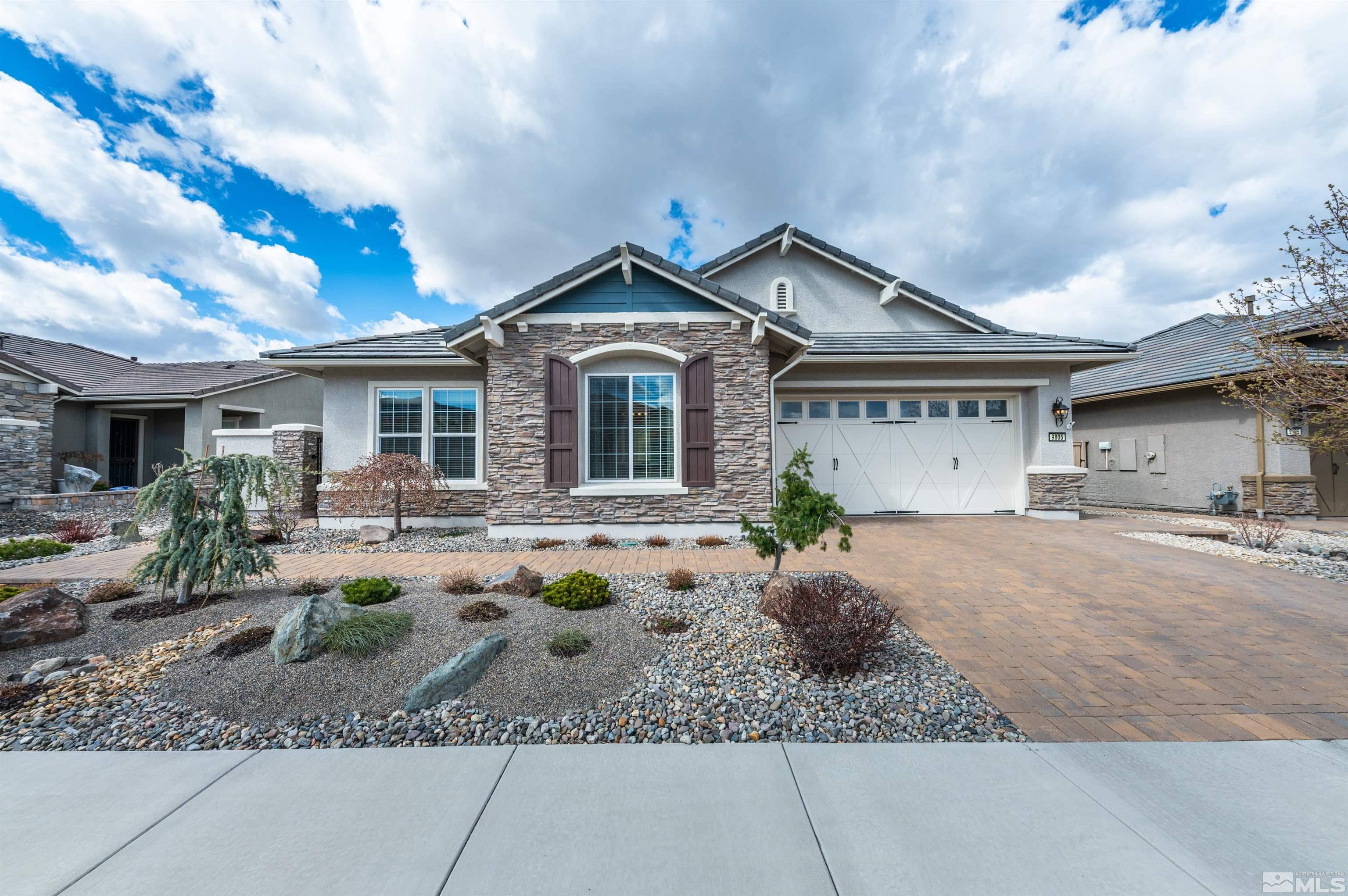 9805 Shadowless Trail Reno, NV 89521 - Photo 2 of 33 a front view of a house with garden and porch