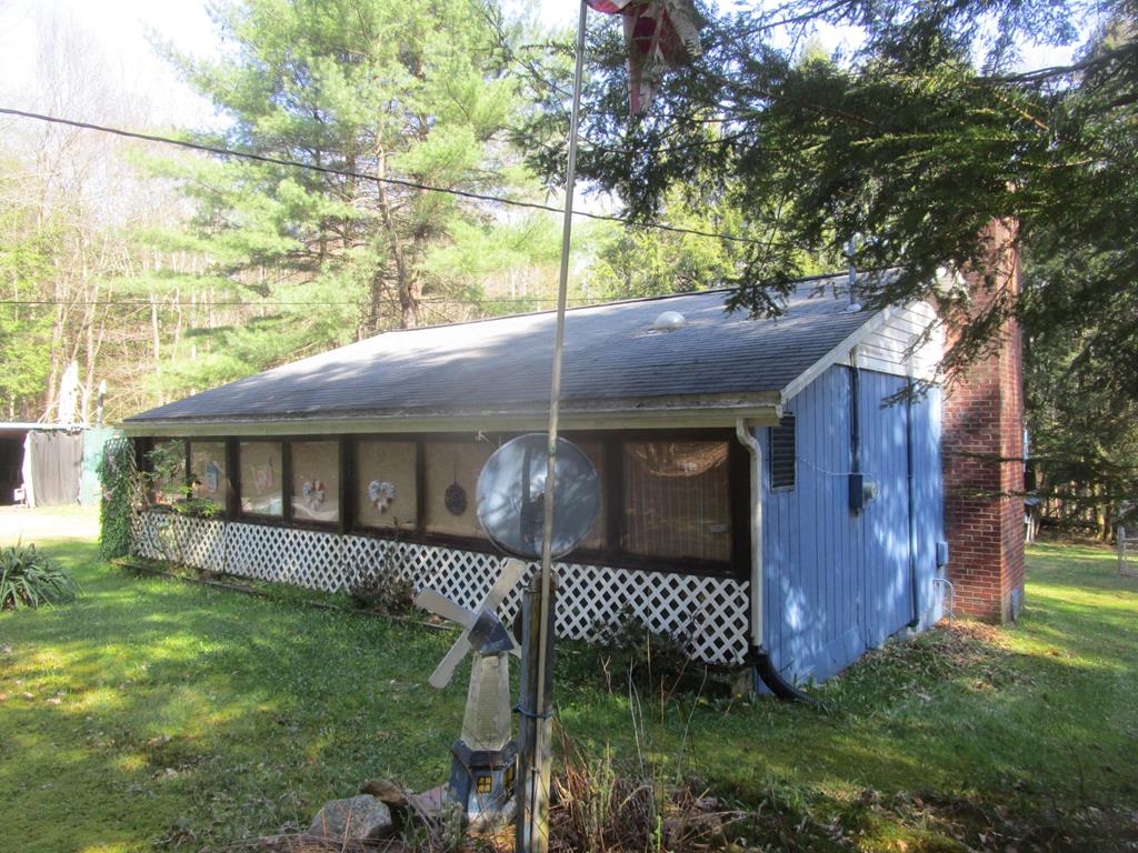 180 Pinetree Road Vowinckel, PA 16260 - Photo 1 of 17 a view of a house with a yard