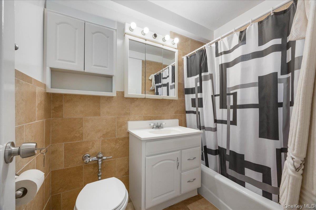 4315 Webster Avenue, Unit 5E Bronx, NY 10470 - Photo 14 of 21 a bathroom with a sink toilet and shower