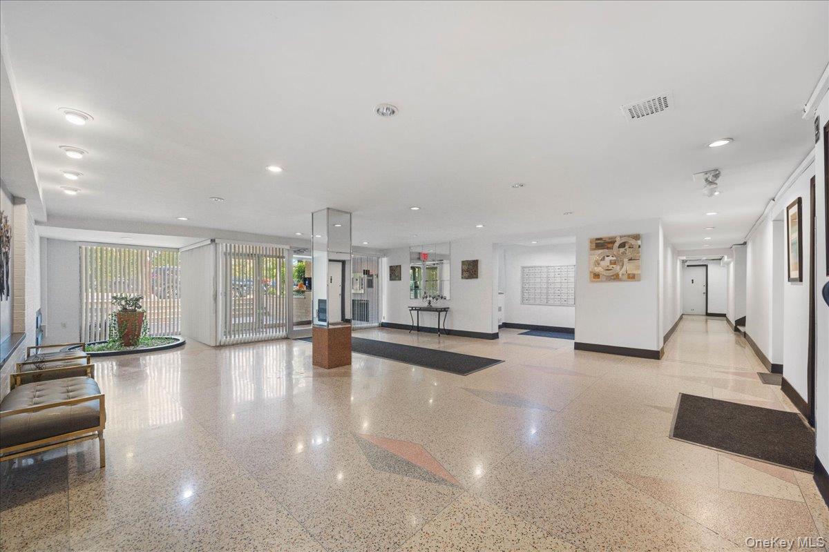 4315 Webster Avenue, Unit 5E Bronx, NY 10470 - Photo 3 of 21 a view of a living room kitchen with a large window