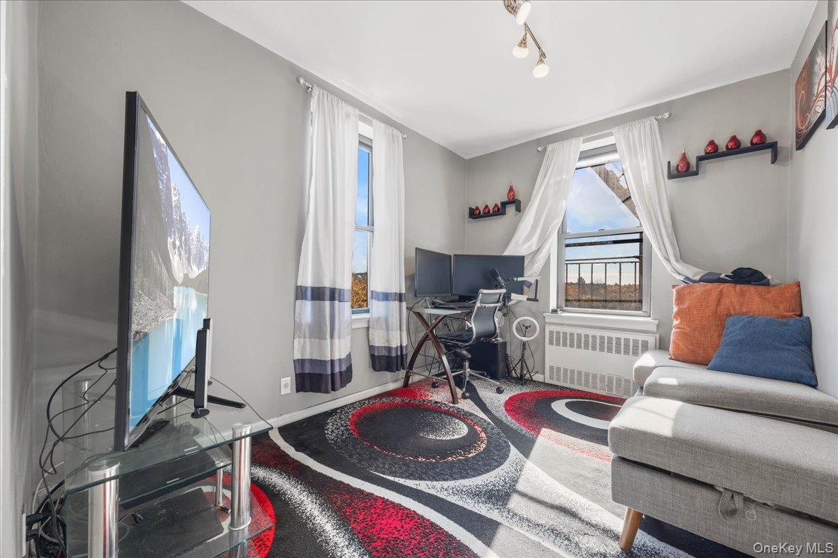 4315 Webster Avenue, Unit 5E Bronx, NY 10470 - Photo 7 of 21 a room with furniture and a wooden floor