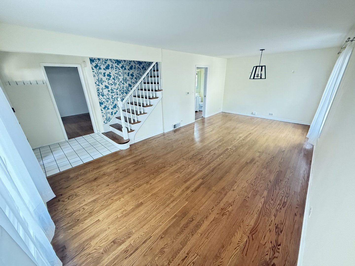36 Washington Road, Unit 1 Lake Forest, IL 60045 - Photo 3 of 17 a view of a room with wooden floor and staircase