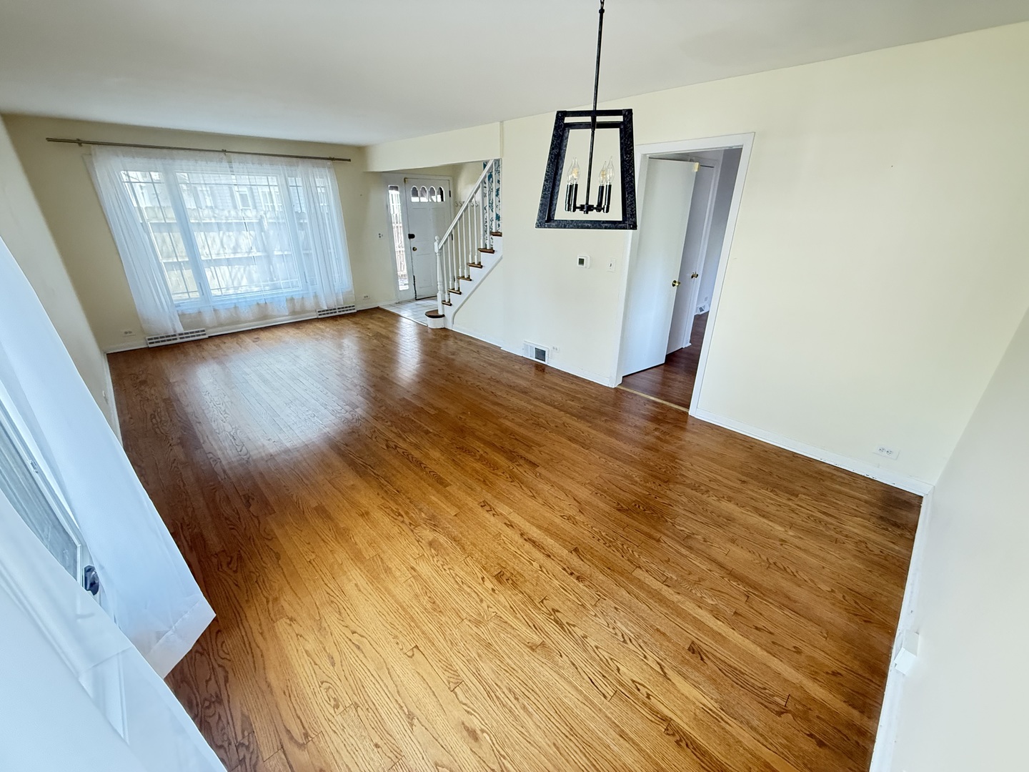 36 Washington Road, Unit 1 Lake Forest, IL 60045 - Photo 4 of 17 a view of an empty room with wooden floor and a window