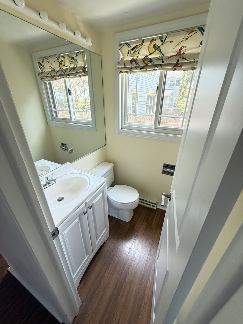 36 Washington Road, Unit 1 Lake Forest, IL 60045 - Photo 5 of 17 a bathroom with a sink a toilet a window and vanity
