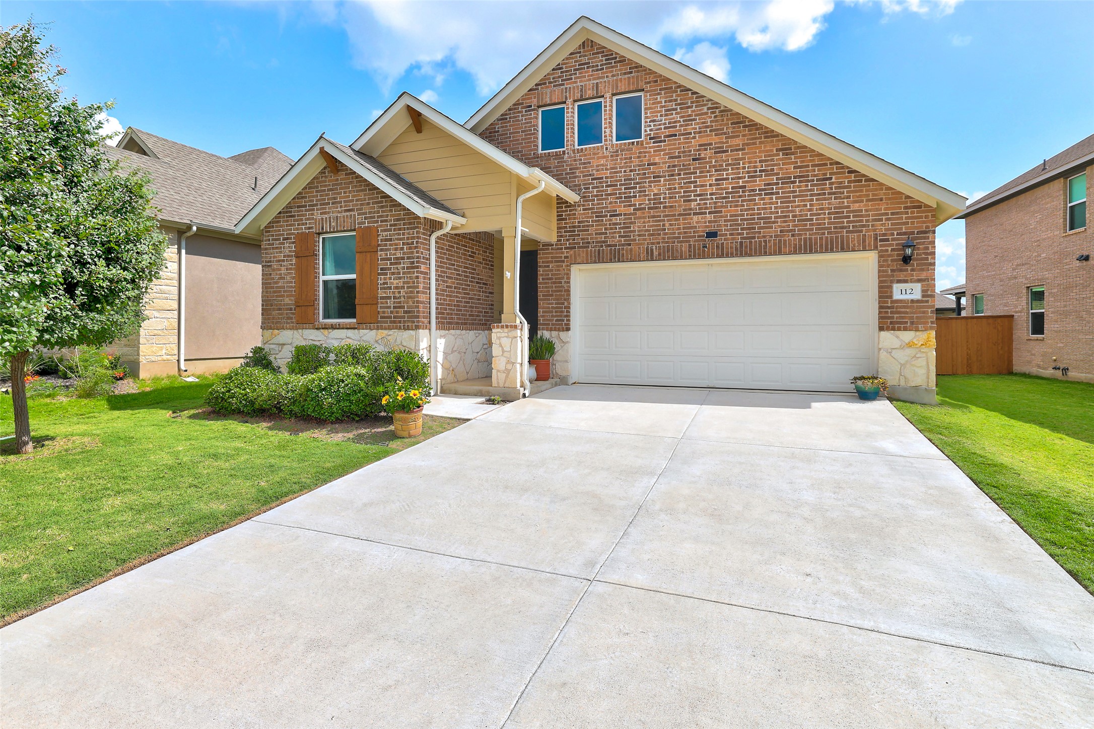 112 Rocking R Court Georgetown, TX 78633 - Photo 2 of 40 A classic brick exterior with stone accents and a well-maintained lawn welcomes you home.