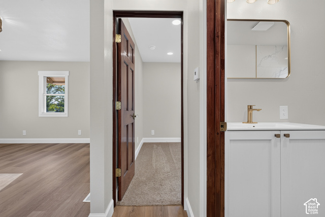 147 Center Street Clearfield, UT 84015 - Photo 18 of 55 Bathroom vanity with a gold-framed mirror, gold-finish faucet, and white cabinetry