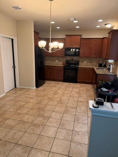 5412 Tama Drive Waco, TX 76708 - Photo 13 of 24 a kitchen with stainless steel appliances kitchen island granite countertop a sink cabinets and a stove