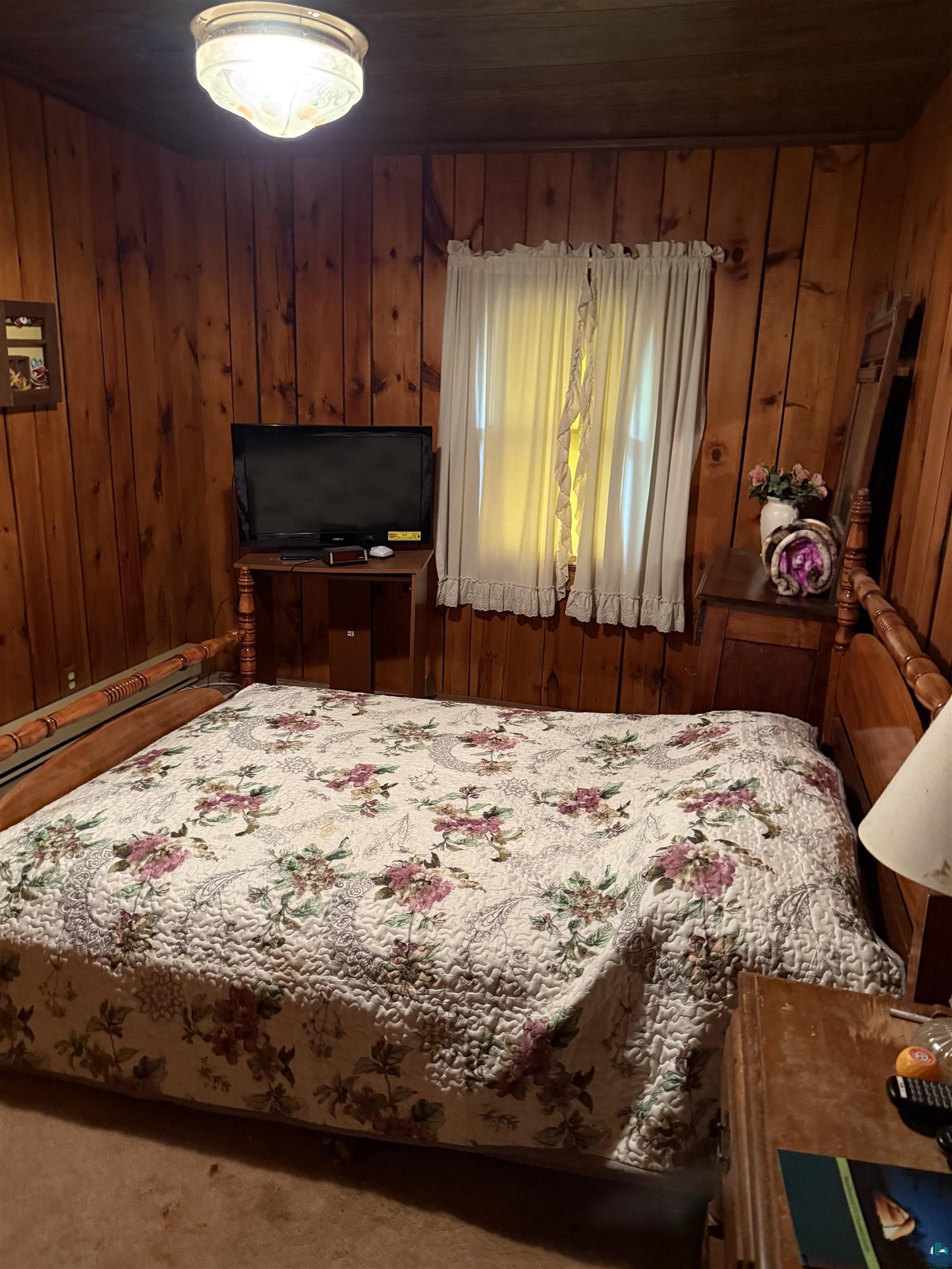 69175 East Long Lake Road Iron River, WI 54847 - Photo 23 of 47 Bedroom featuring wooden walls