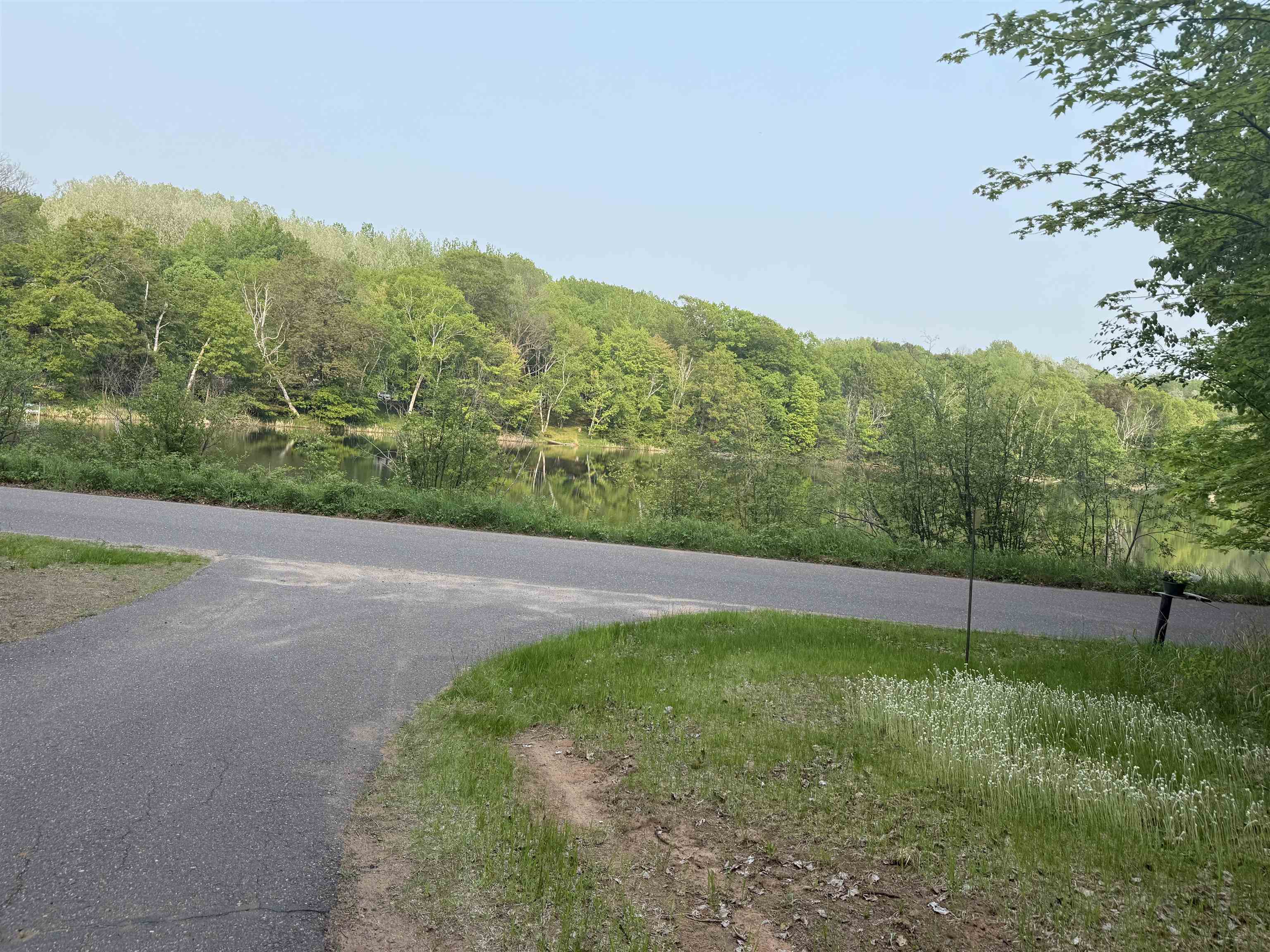 69175 East Long Lake Road Iron River, WI 54847 - Photo 43 of 47 View of asphalt road with a forest view