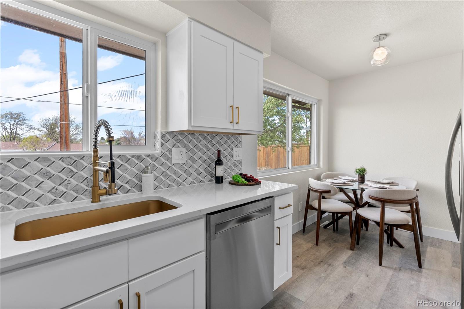 7961 Granada Road Denver, CO 80221 - Photo 11 of 31 a kitchen with a sink and a window