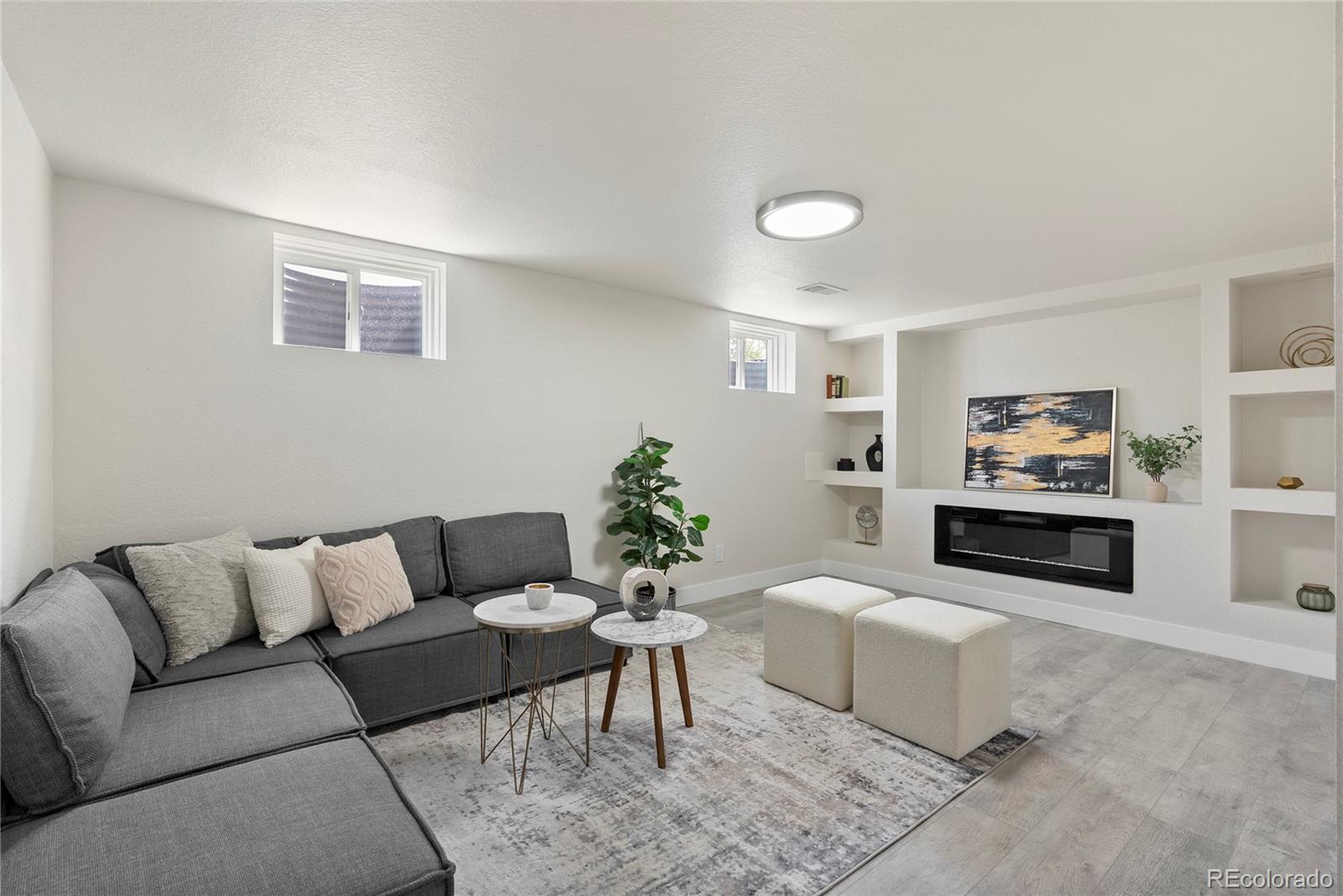 7961 Granada Road Denver, CO 80221 - Photo 20 of 31 a living room with furniture and a couch