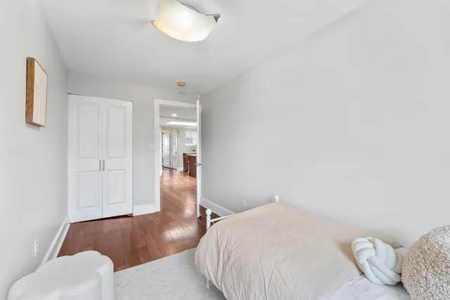a bedroom with a bed and cabinets