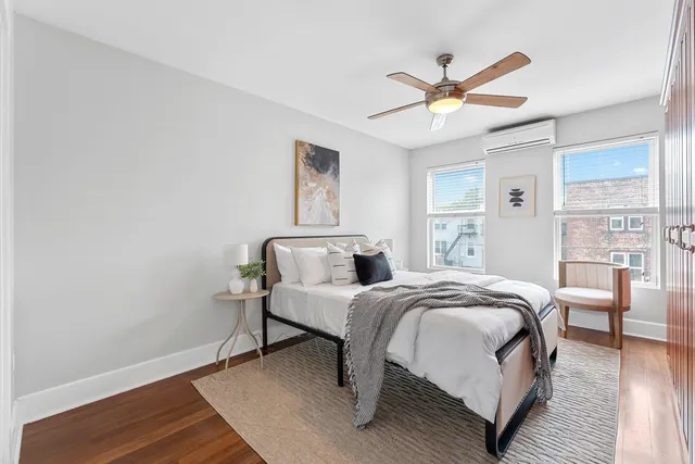 a bedroom with a bed and window