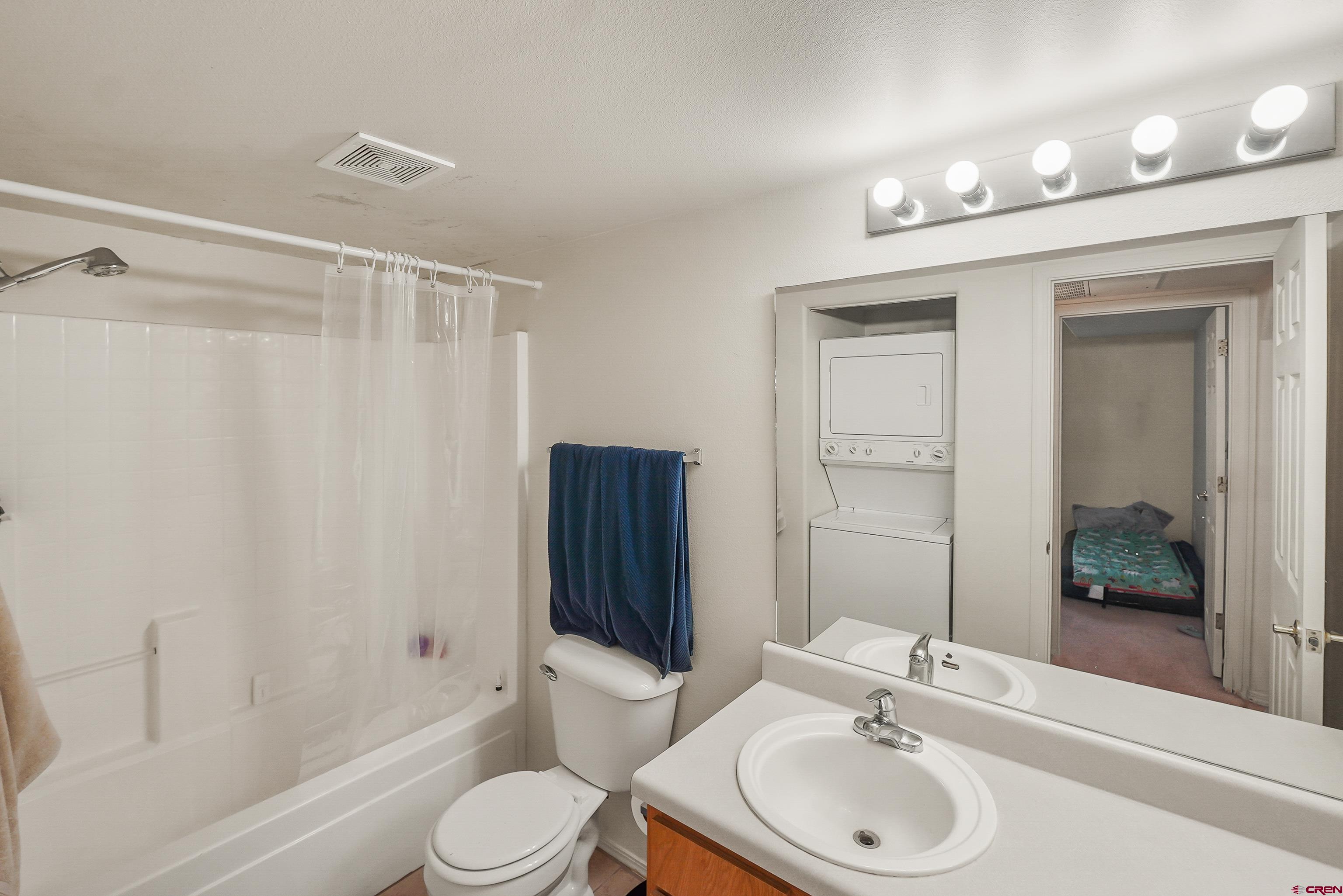1100 Goeglein Gulch Road, Unit 155 Durango, CO 81301 - Photo 12 of 15 a bathroom with a sink toilet and shower