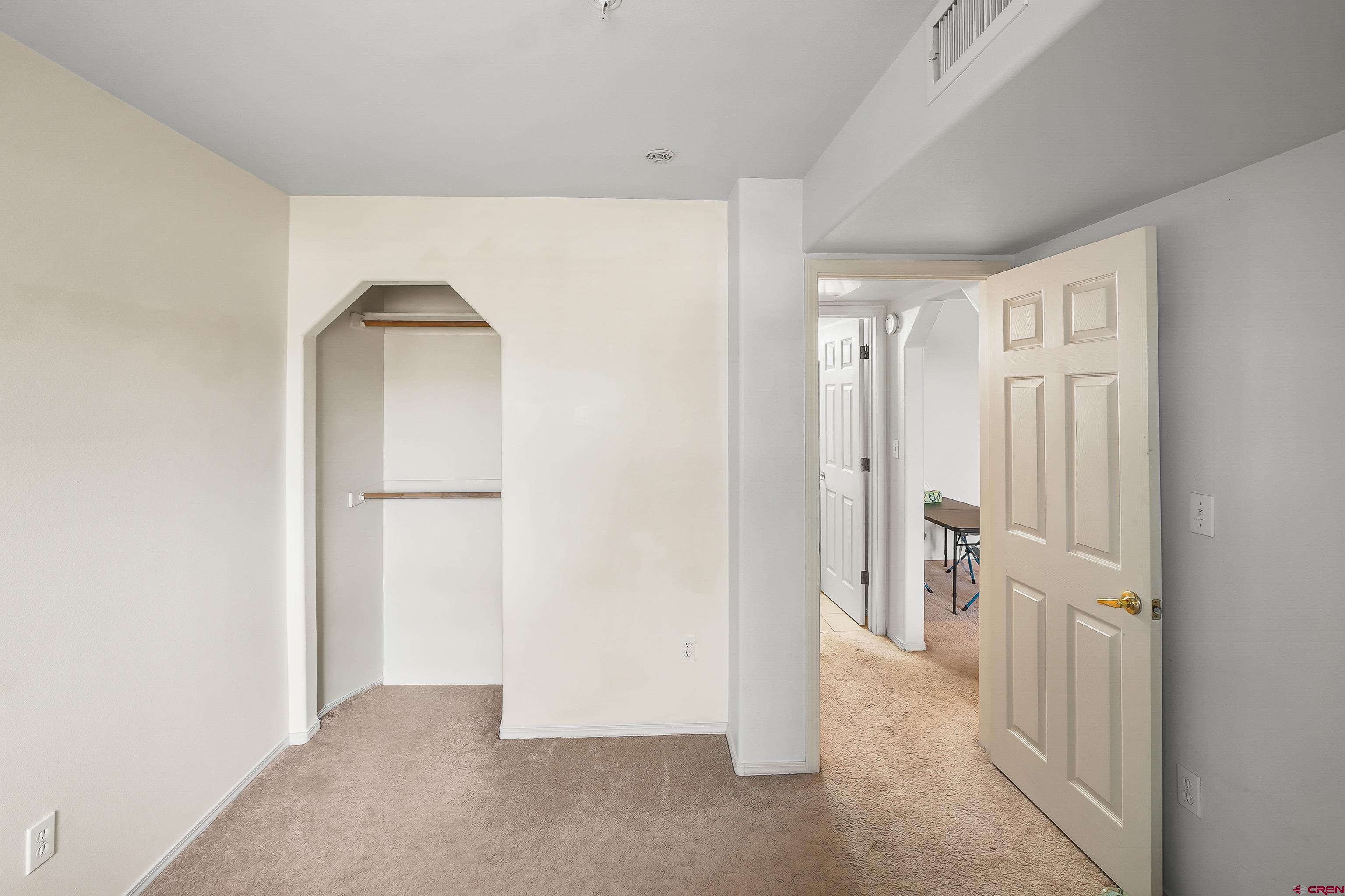 1100 Goeglein Gulch Road, Unit 155 Durango, CO 81301 - Photo 14 of 15 an empty room with a door