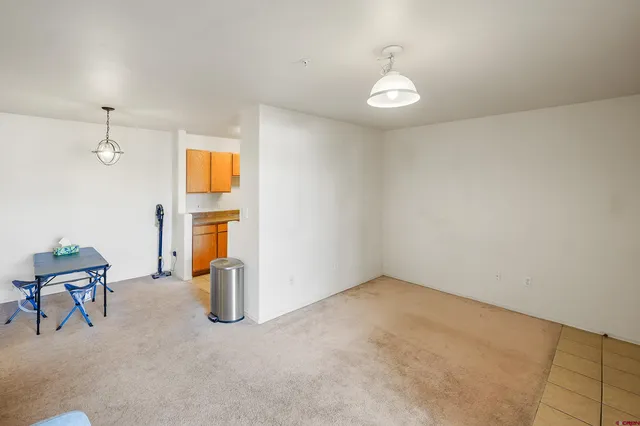 a view of livingroom with furniture and chandelier fan