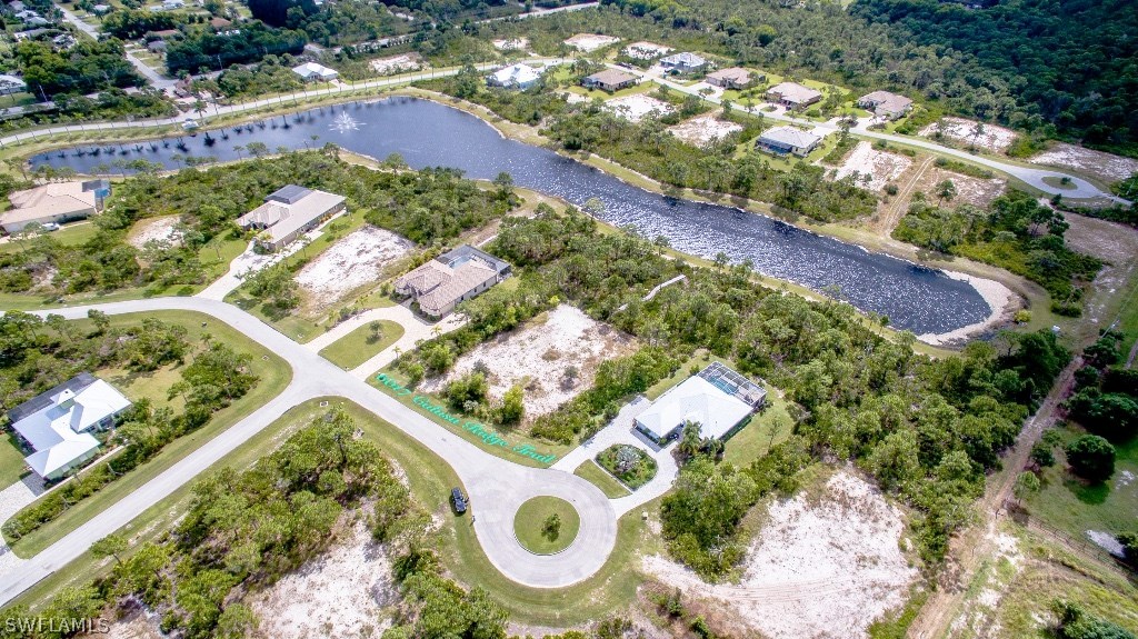 6017 Calusa Rdg Trail Bokeelia, FL 33922 - Photo 1 of 24 a view of swimming pool with a yard and plants