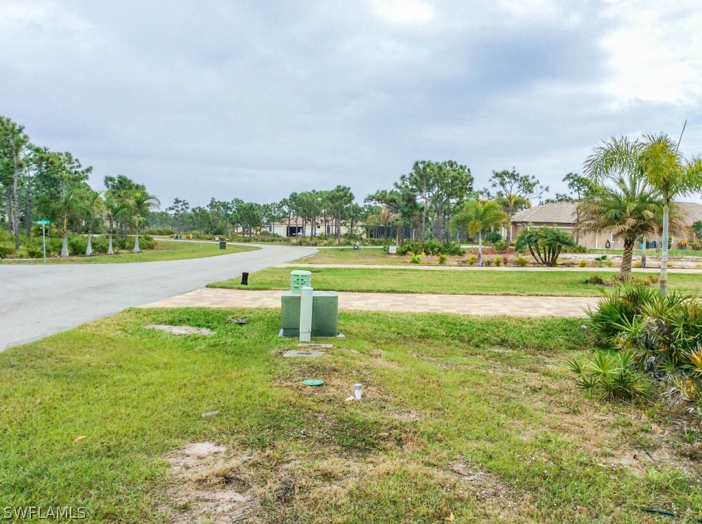 6017 Calusa Rdg Trail Bokeelia, FL 33922 - Photo 19 of 24 a view of a golf course with a lake