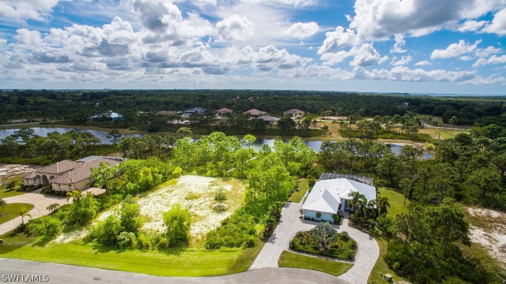 6017 Calusa Rdg Trail Bokeelia, FL 33922 - Photo 2 of 24 a view of a lake in middle of the town