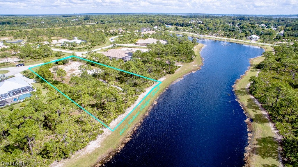 6017 Calusa Rdg Trail Bokeelia, FL 33922 - Photo 5 of 24 a view of a lake with a mountain view