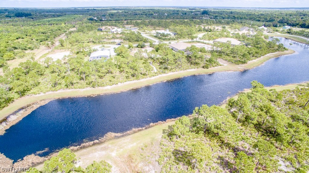 6017 Calusa Rdg Trail Bokeelia, FL 33922 - Photo 8 of 24 a view of a lake from a yard