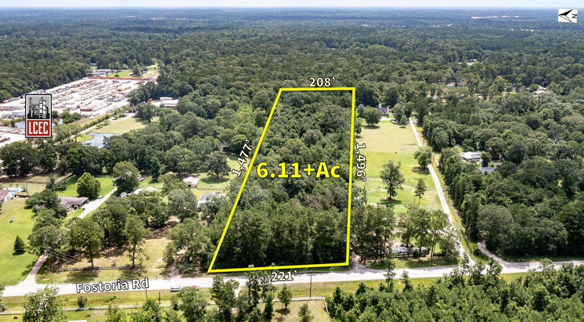 an aerial view of a residential apartment building with a yard