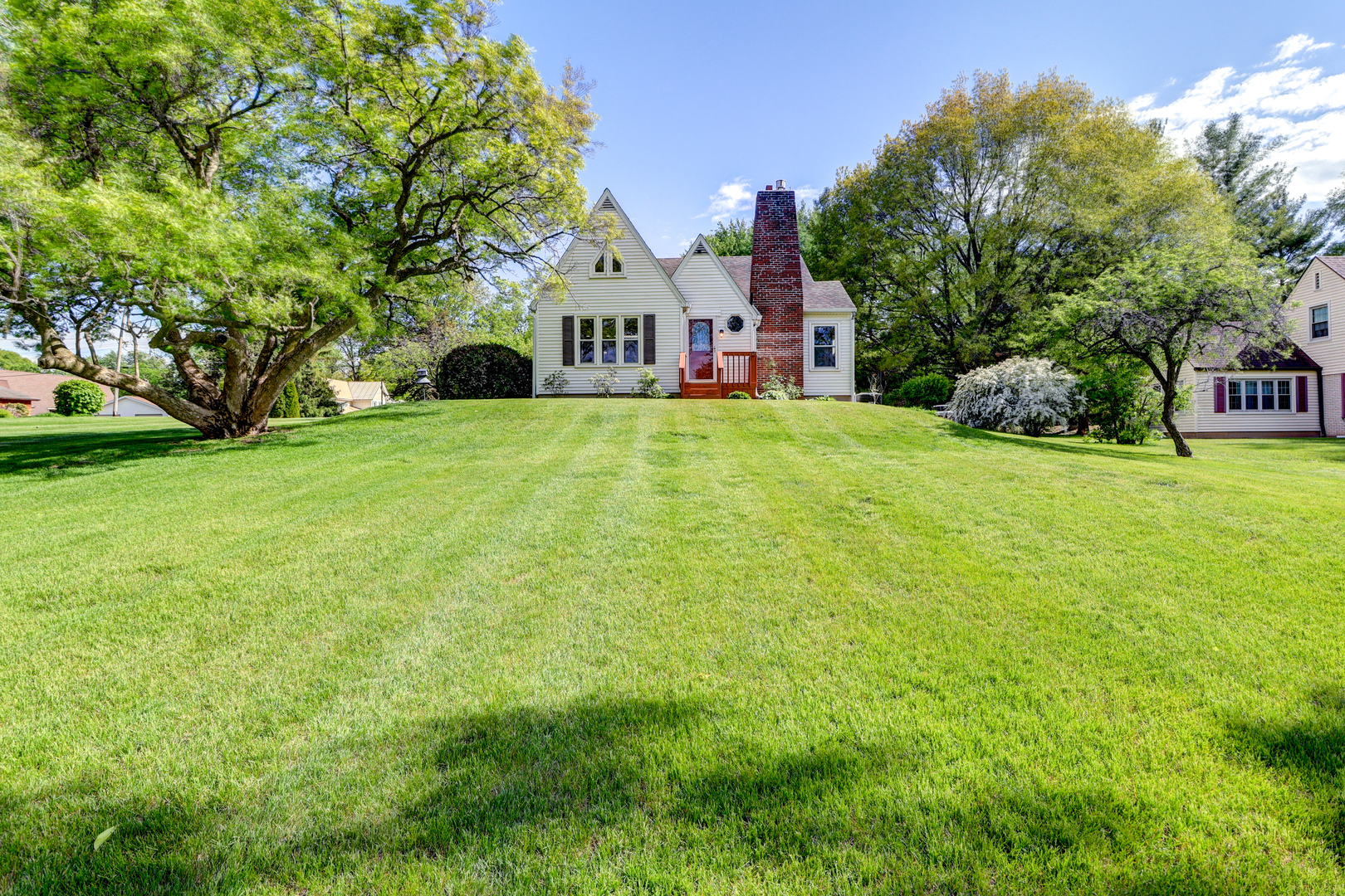 313 West 2nd Street Prophetstown, IL 61277 - Photo 1 of 22 a view of a house with a big yard and large trees