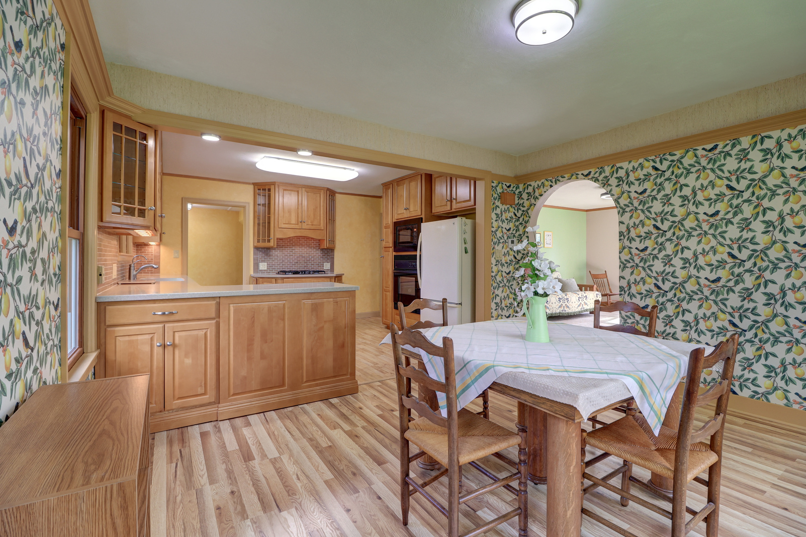 313 West 2nd Street Prophetstown, IL 61277 - Photo 5 of 22 a kitchen with a table chairs refrigerator and cabinets
