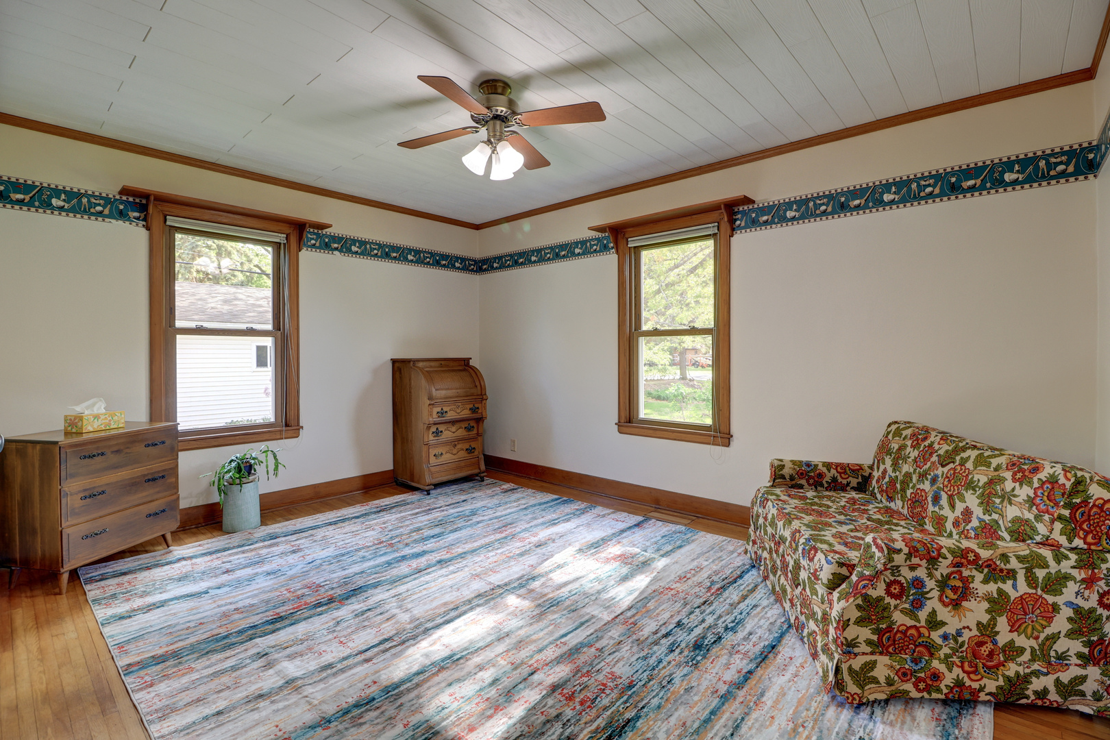 313 West 2nd Street Prophetstown, IL 61277 - Photo 8 of 22 a bedroom with a bed and a chandelier