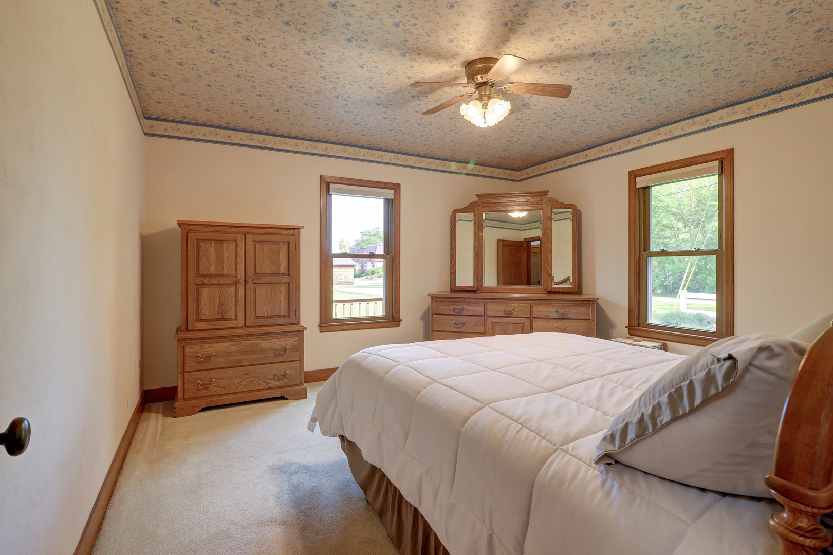 313 West 2nd Street Prophetstown, IL 61277 - Photo 9 of 22 a bedroom with a bed and a chandelier