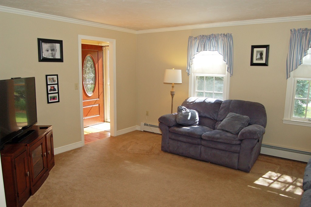6 Schofield Road Hopkinton, MA 01748 - Photo 11 of 30 a living room with furniture and a flat screen tv