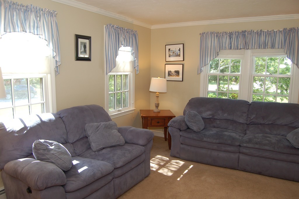 6 Schofield Road Hopkinton, MA 01748 - Photo 12 of 30 a living room with furniture and a large window