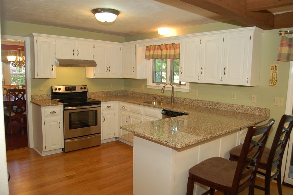 6 Schofield Road Hopkinton, MA 01748 - Photo 2 of 30 a kitchen that has a sink a stove and window
