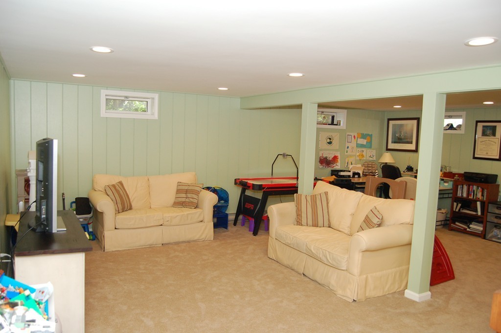 6 Schofield Road Hopkinton, MA 01748 - Photo 21 of 30 a living room with furniture and a couch