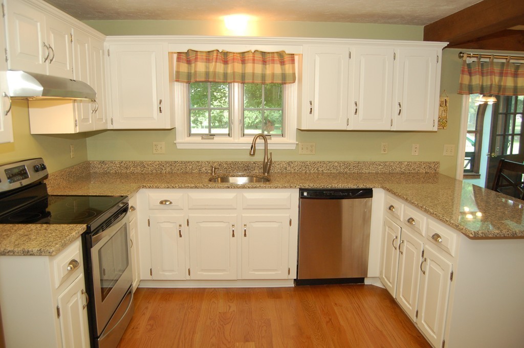 6 Schofield Road Hopkinton, MA 01748 - Photo 3 of 30 a kitchen with a sink a stove and cabinets