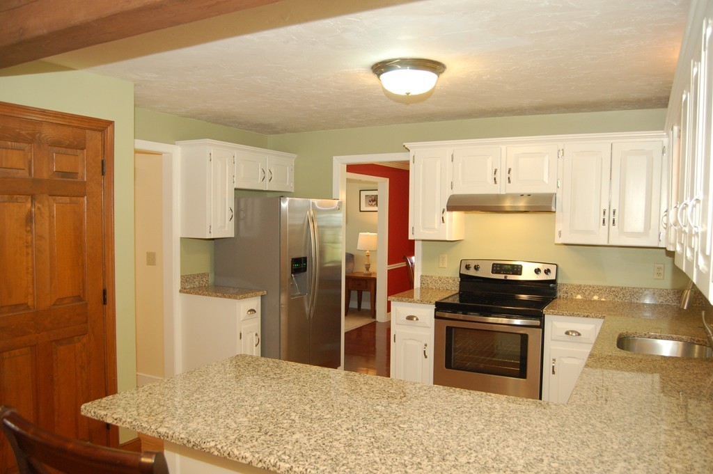 6 Schofield Road Hopkinton, MA 01748 - Photo 5 of 30 a kitchen with stainless steel appliances granite countertop a refrigerator and a stove