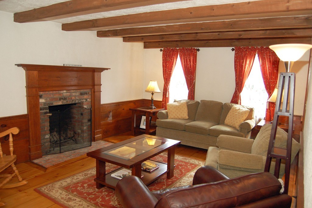 6 Schofield Road Hopkinton, MA 01748 - Photo 9 of 30 a living room with furniture and a fireplace