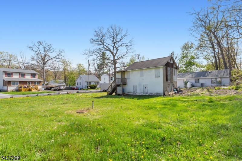 19 Dunham Road West Milford, NJ 07421 - Photo 6 of 14 a backyard of a house with table and chairs