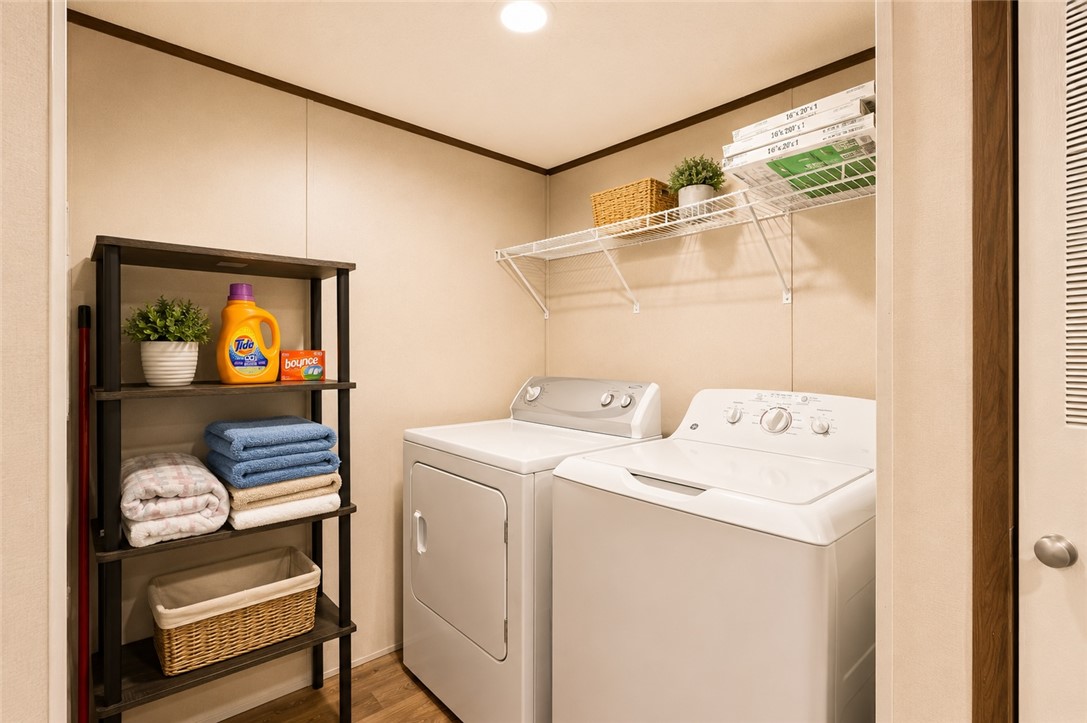 101 Drucker Ridge Anderson, SC 29625 - Photo 19 of 20 A well-organized utility room features a washer and dryer.