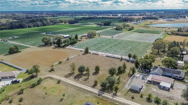 an aerial view of a house with outdoor space