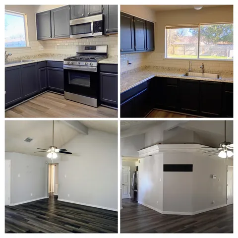 a kitchen with stainless steel appliances granite countertop a stove a sink and a microwave