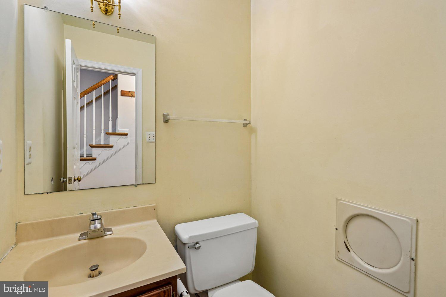 10802 Dayflower Court Reston, VA 20191 - Photo 15 of 44 Main level powder room with a laundry chute